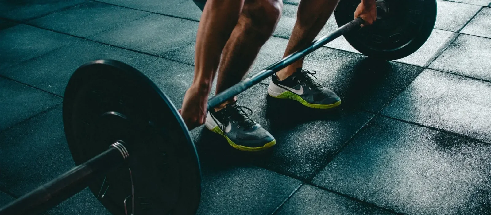 Athlete lifting a loaded barbell during strength training