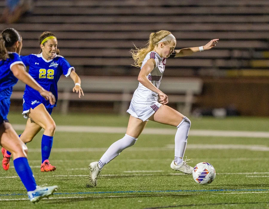 Grace Overton playing collegiate soccer for Guilford College